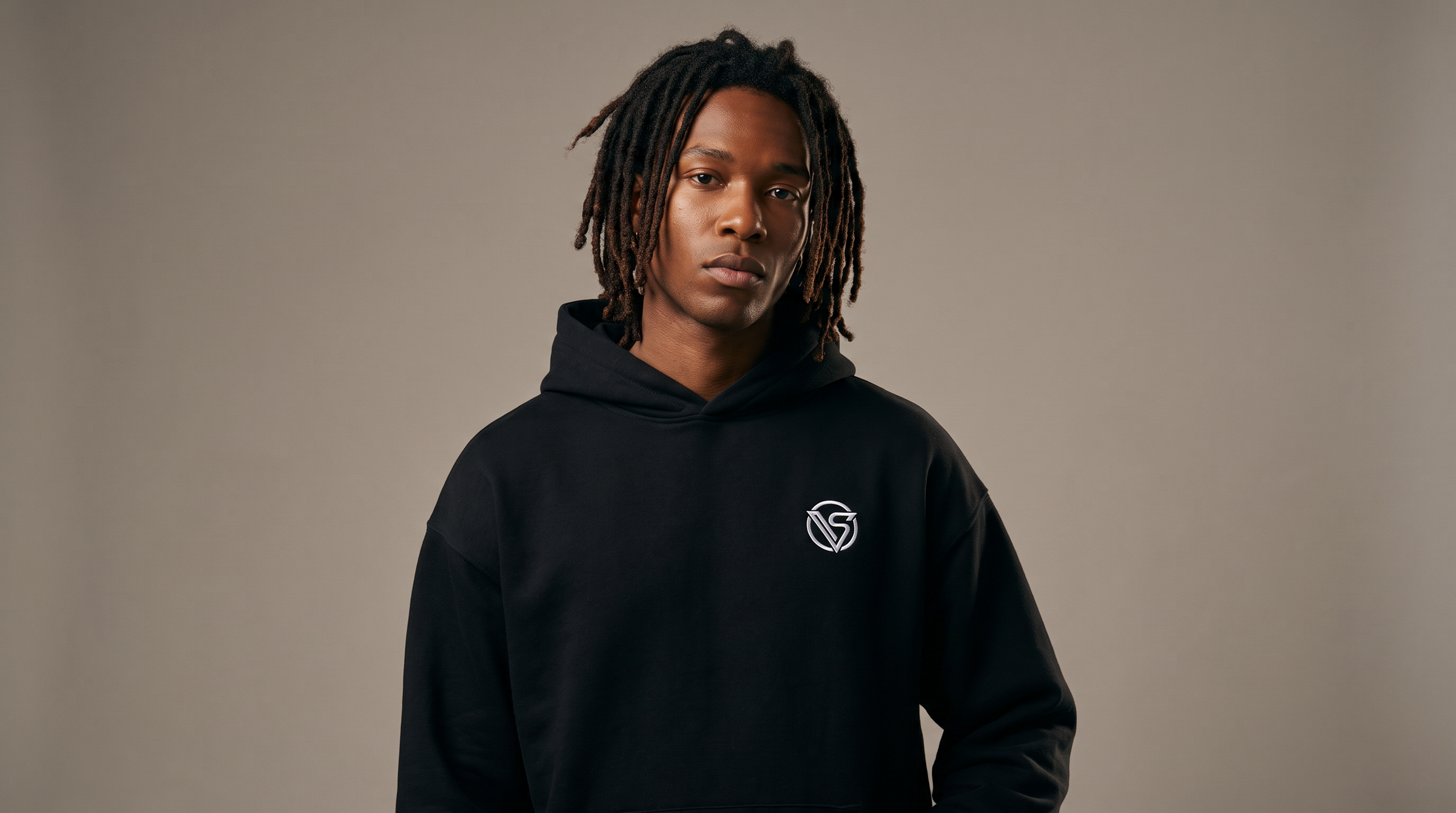 Model wearing Visionair Society black hoodie in studio — Meridian Drop 01 streetwear